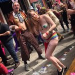 Revellers take selfies and party inside wild Mardi Gras festival in New Orleans
