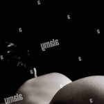 Naked or nude sexy woman back on black background.Low key light.Room for text Stock Photo
