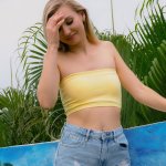Slim blonde Emma Sirus gets naked and unveils her small boobs
