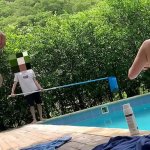 Natasha and Megan go out to tan while the guy cleans the pool and then swim naked with the lucky guy