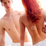 A Lovely Couple Relaxing Naked in the Bed Stock Photo