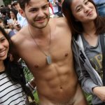 Nude man with clothed females