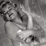 Naked woman taking shower